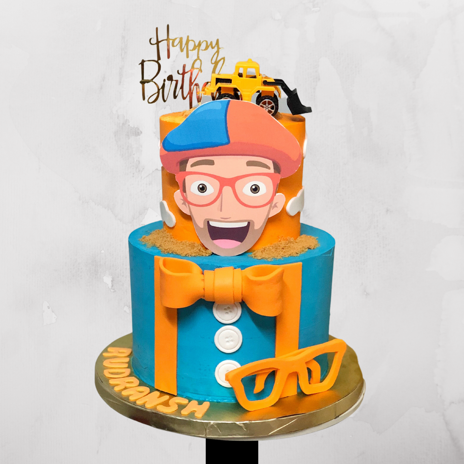 Blippi-Inspired Cake with Bow Tie & Toy Truck